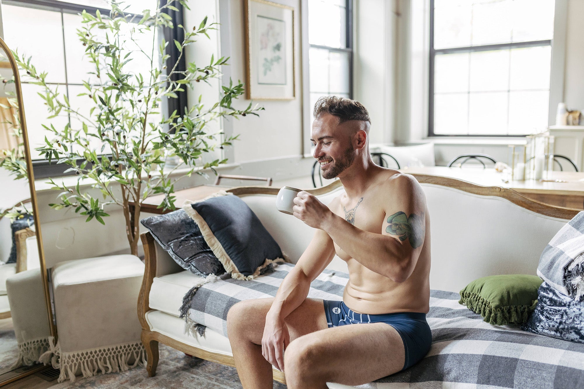 testicle support pouch, man drinking coffee